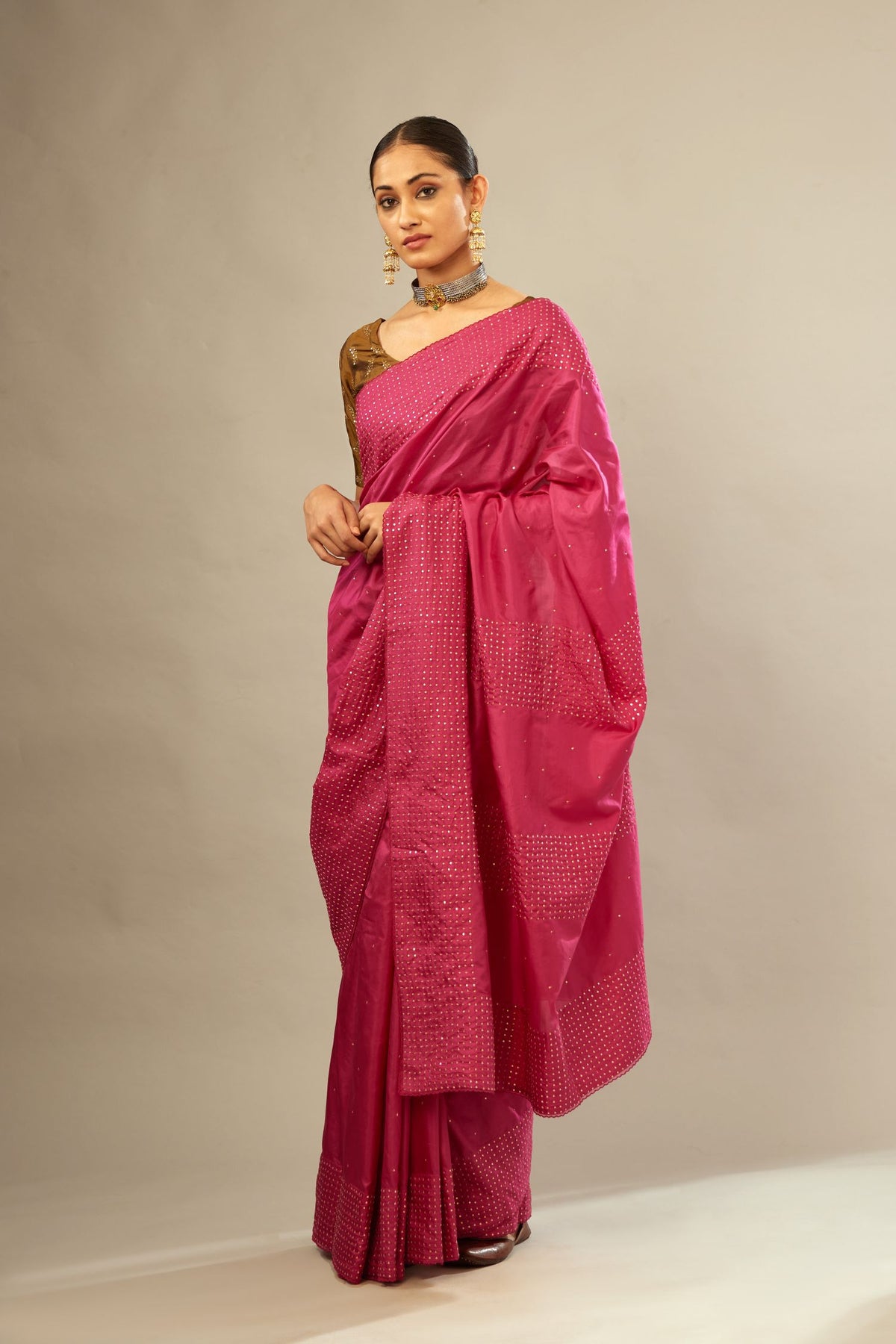 Jazzberry jam silk saree set with a broad border of hand embroidered geometrically aligned sequins and three horizontal bands at the pallu.