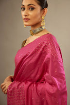 Jazzberry jam silk saree set with a broad border of hand embroidered geometrically aligned sequins and three horizontal bands at the pallu.