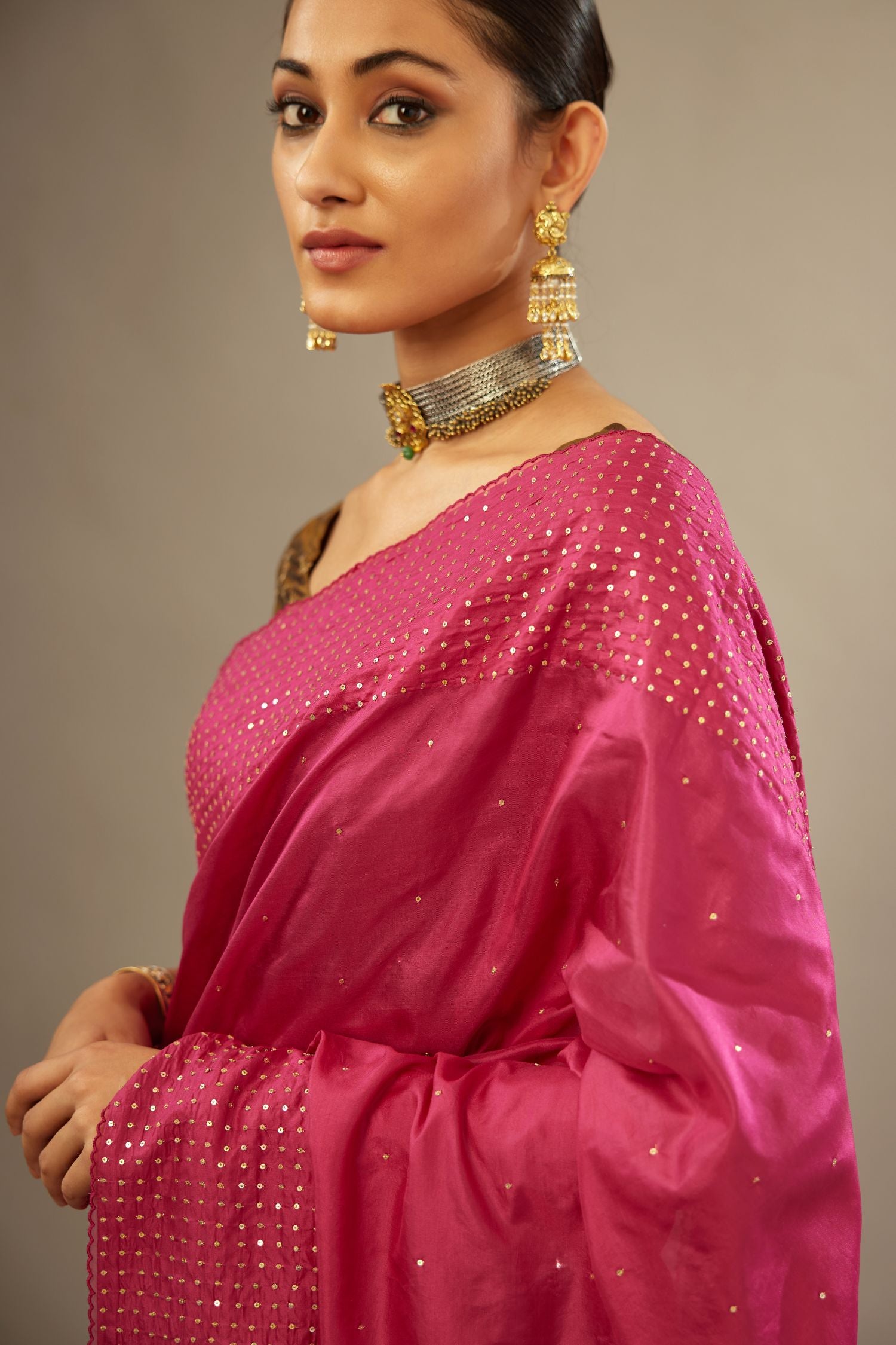 Jazzberry jam silk saree set with a broad border of hand embroidered geometrically aligned sequins and three horizontal bands at the pallu.