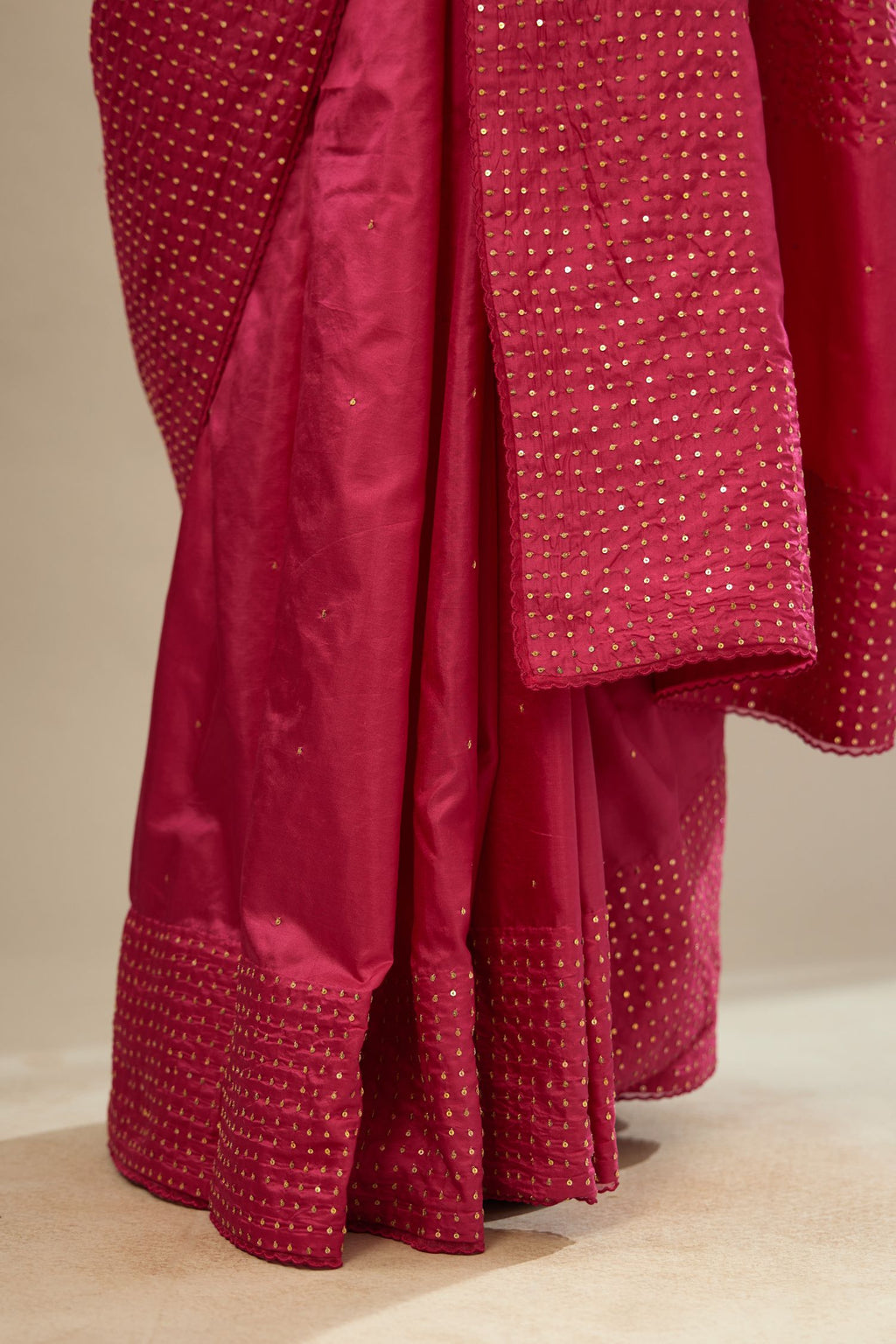 Jazzberry jam silk saree set with a broad border of hand embroidered geometrically aligned sequins and three horizontal bands at the pallu.