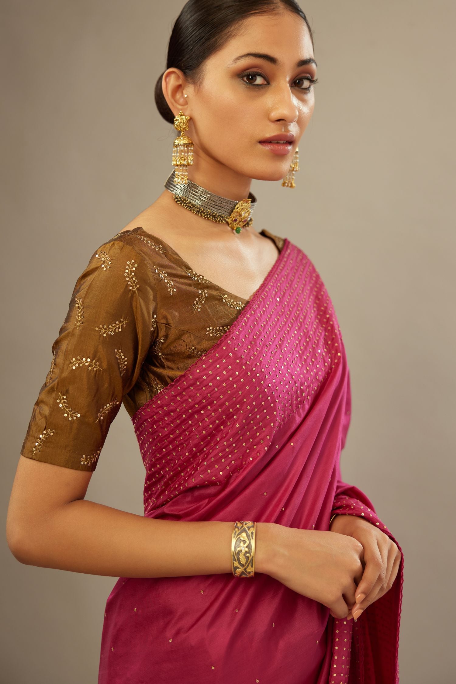 Jazzberry jam silk saree set with a broad border of hand embroidered geometrically aligned sequins and three horizontal bands at the pallu.