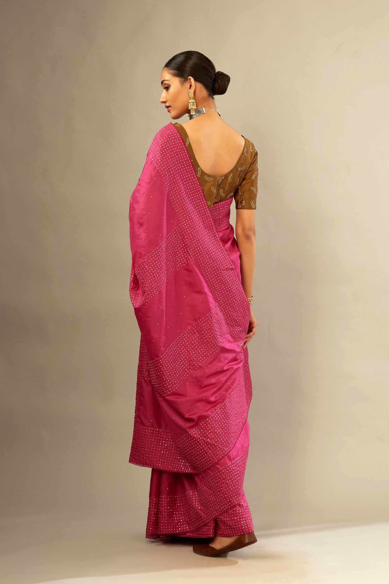 Jazzberry jam silk saree set with a broad border of hand embroidered geometrically aligned sequins and three horizontal bands at the pallu.