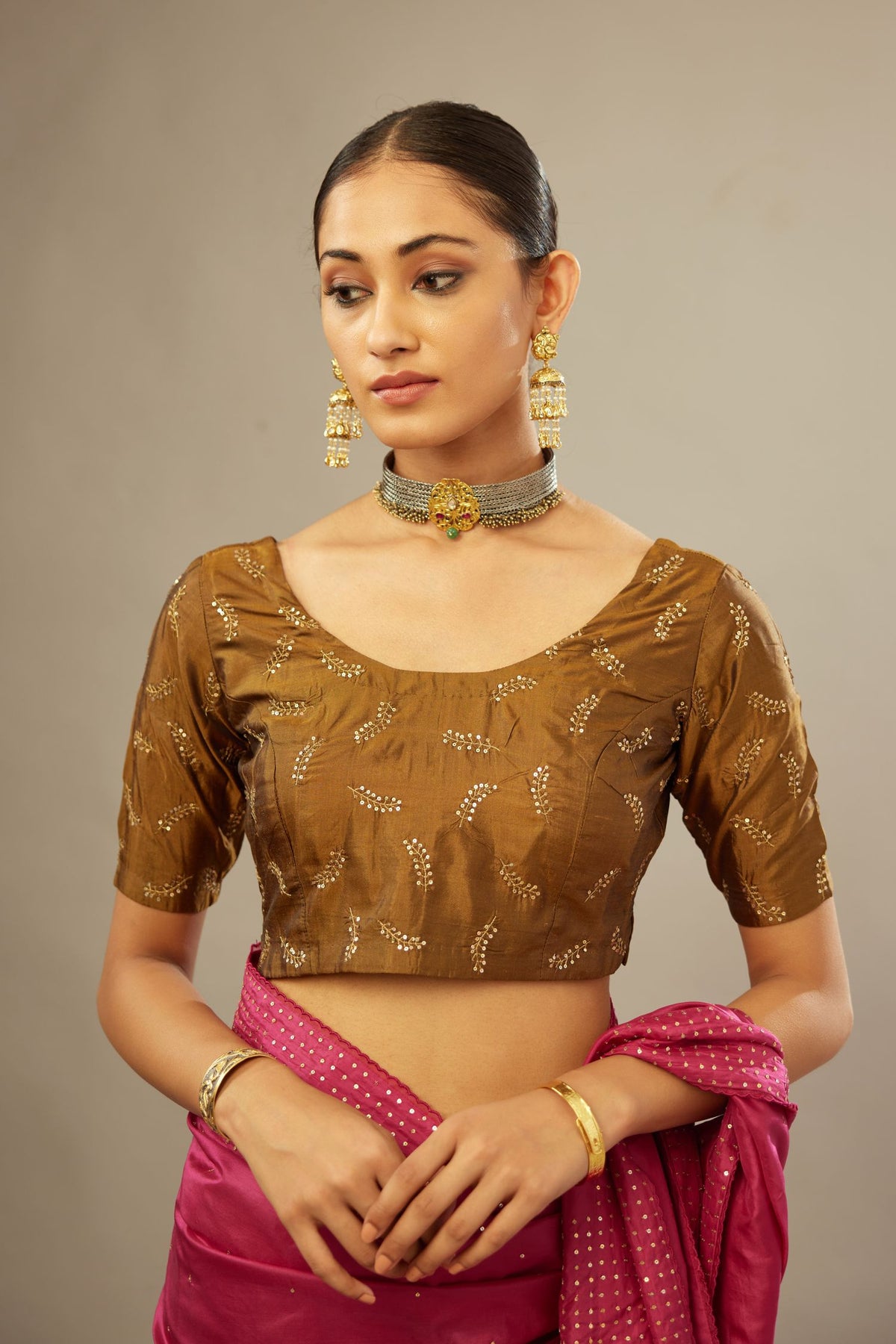 Golden olive silk blouse with princess seams and all-over hand embroidered delicate sequins leaf motifs.