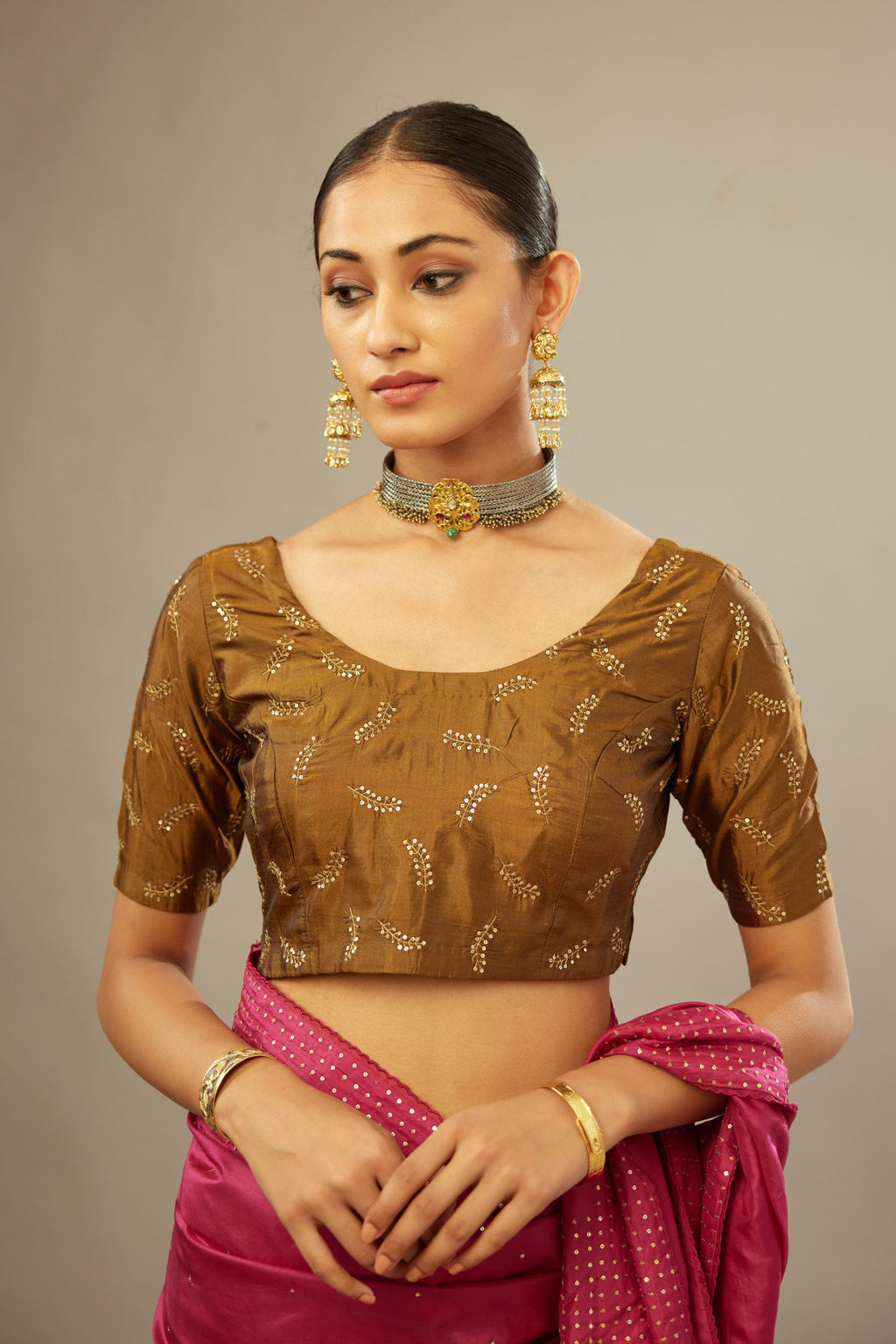 Golden olive silk blouse with princess seams and all-over hand embroidered delicate sequins leaf motifs.