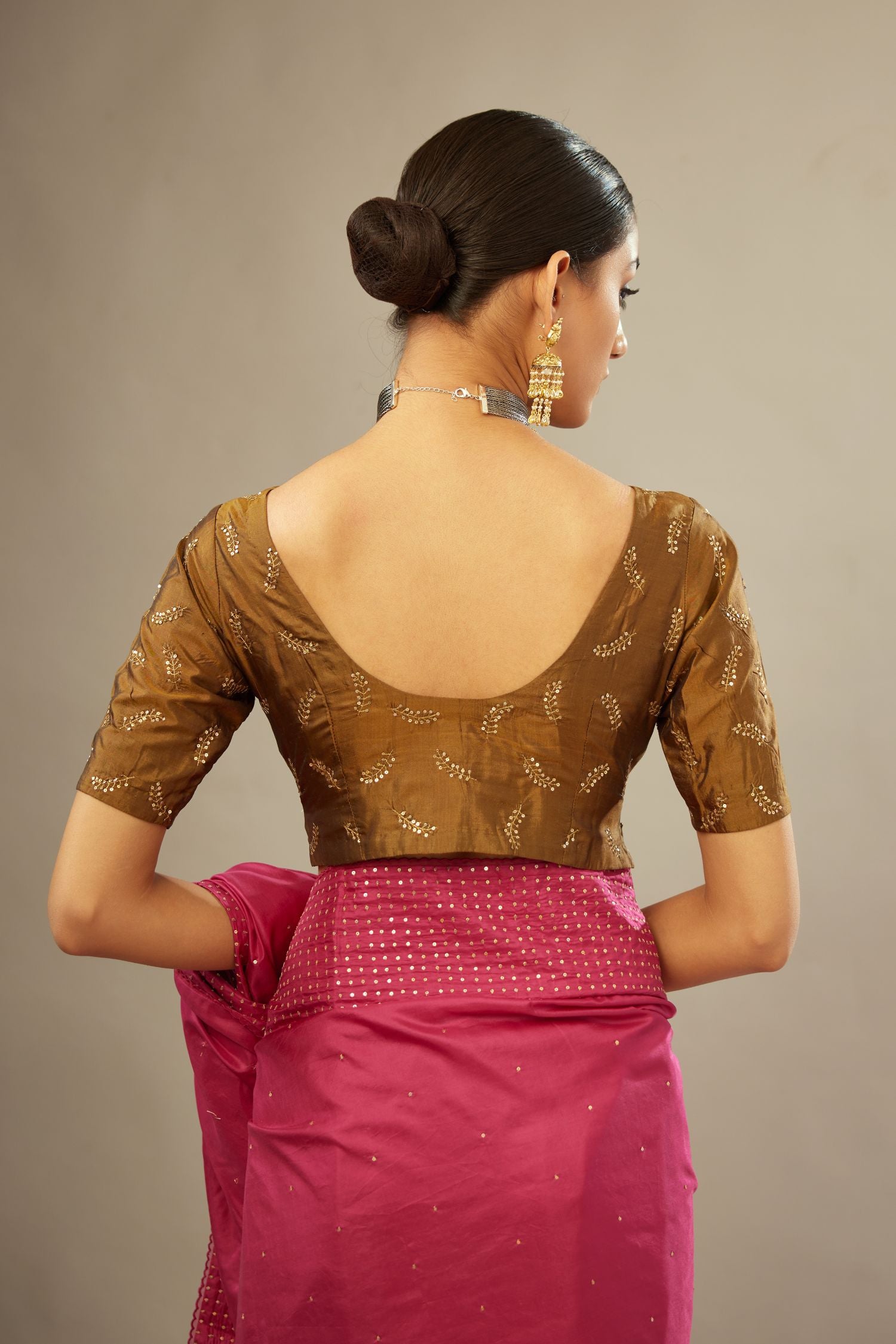 Jazzberry jam silk saree set with a broad border of hand embroidered geometrically aligned sequins and three horizontal bands at the pallu.