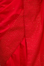 Red silk saree set with a broad border of hand embroidered geometrically aligned sequins and three horizontal bands at the pallu.
