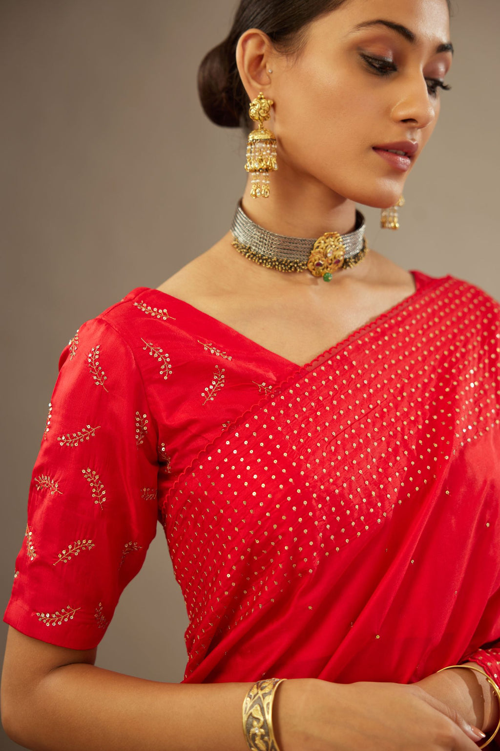 Red silk blouse with princess seams and all-over hand embroidered delicate sequins leaf motifs.