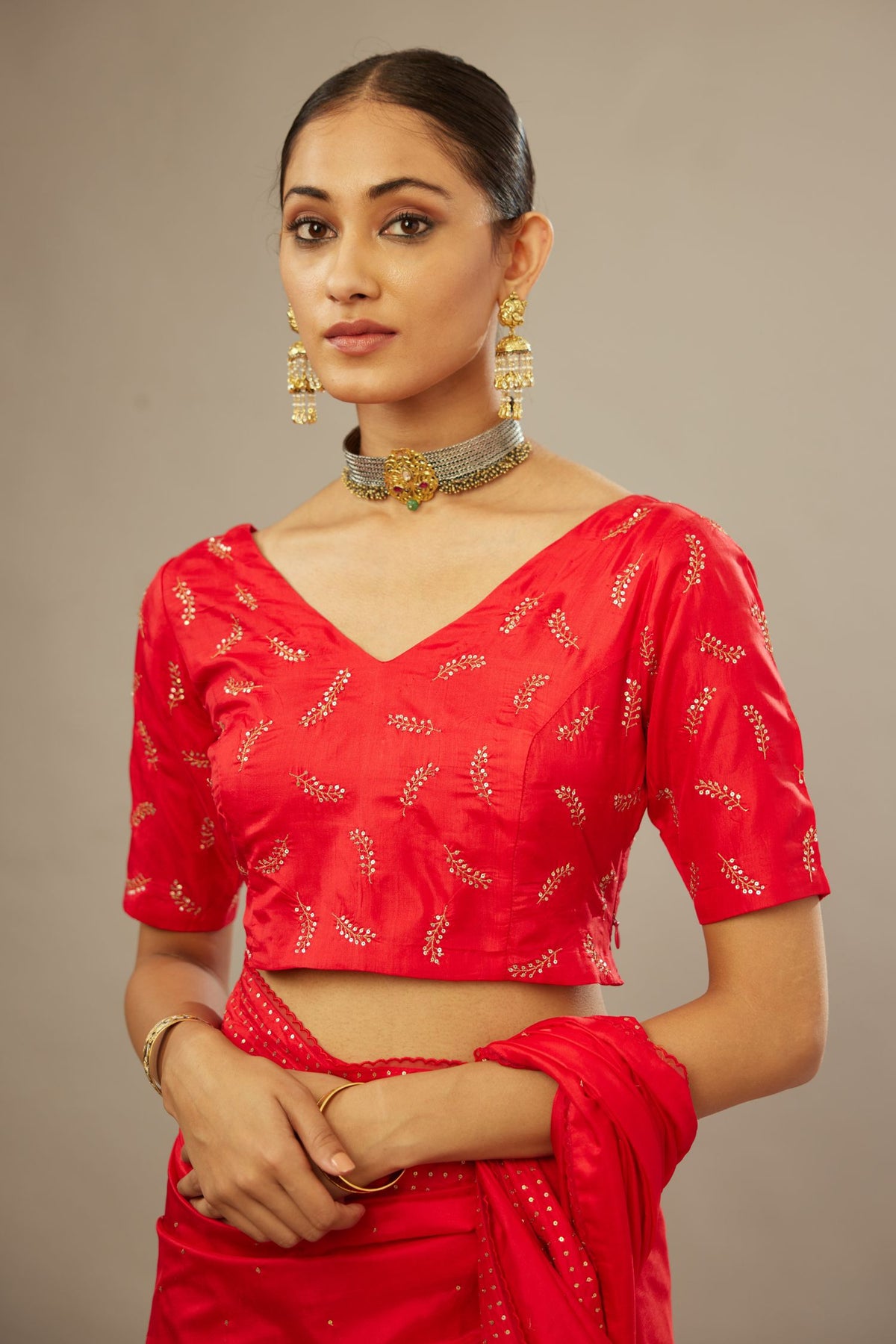 Red silk blouse with princess seams and all-over hand embroidered delicate sequins leaf motifs.