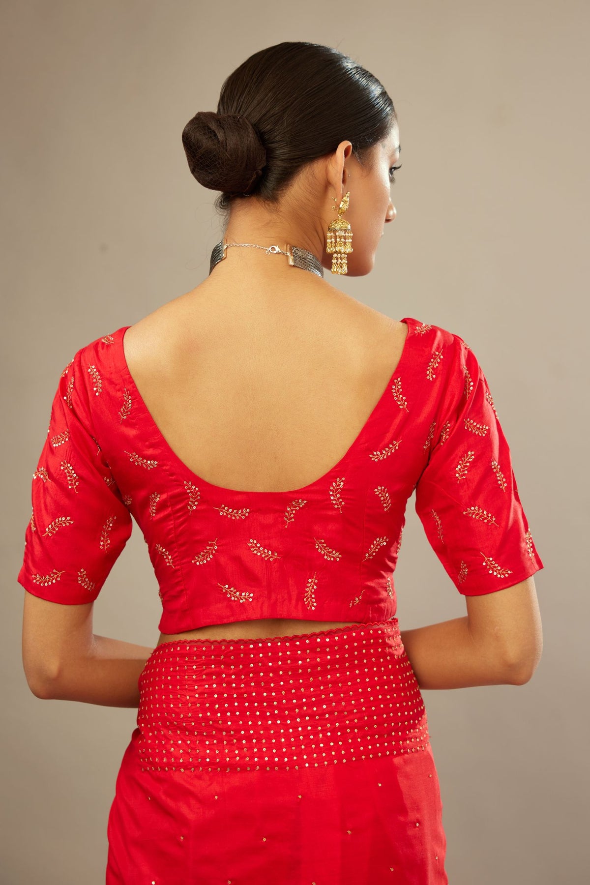 Red silk blouse with princess seams and all-over hand embroidered delicate sequins leaf motifs.
