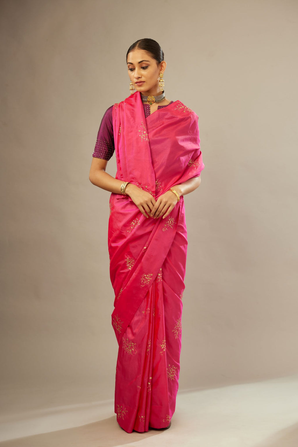 Raspberry silk saree set with hand embroidered delicate sequins floral butas all over.