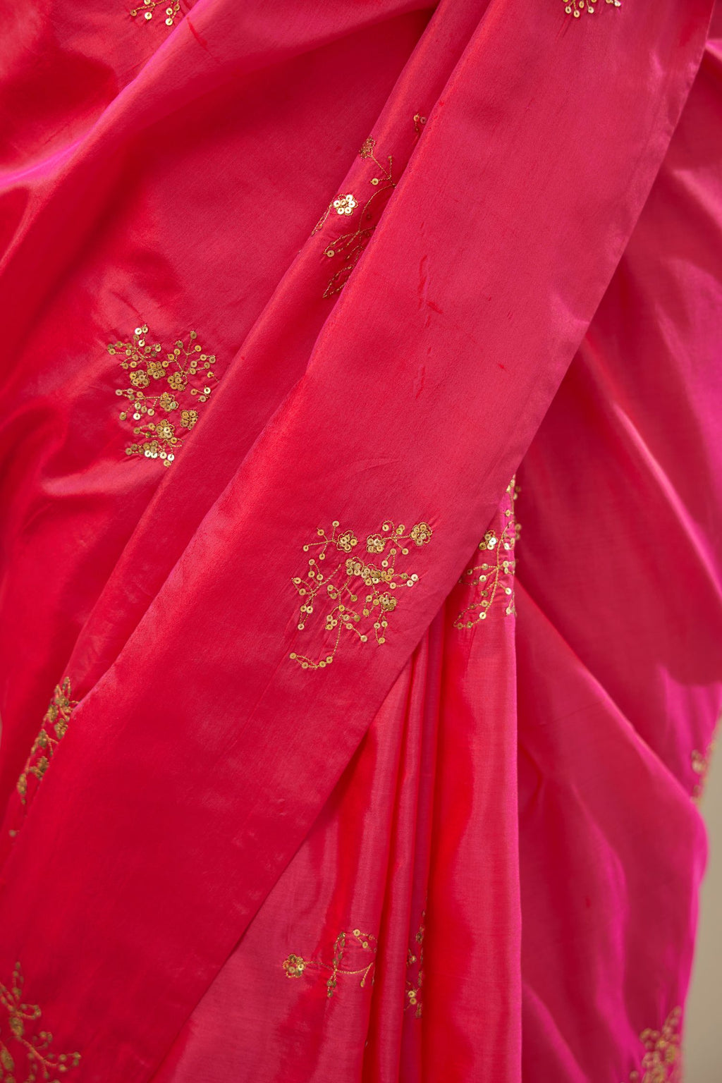 Raspberry silk saree set with hand embroidered delicate sequins floral butas all over.