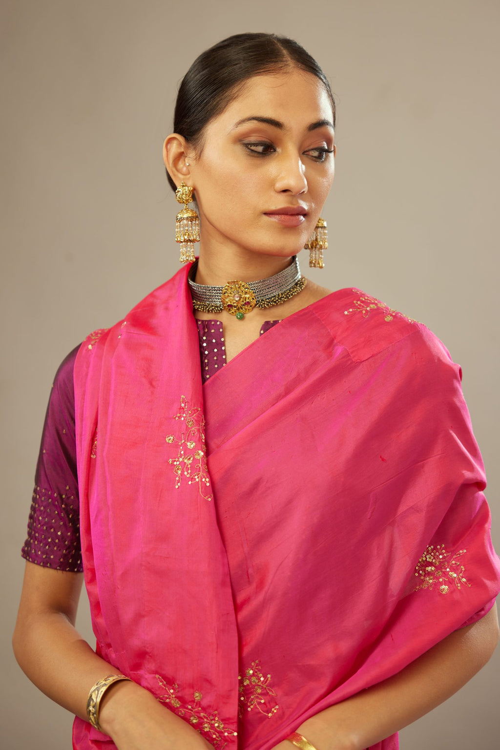 Raspberry silk saree set with hand embroidered delicate sequins floral butas all over.