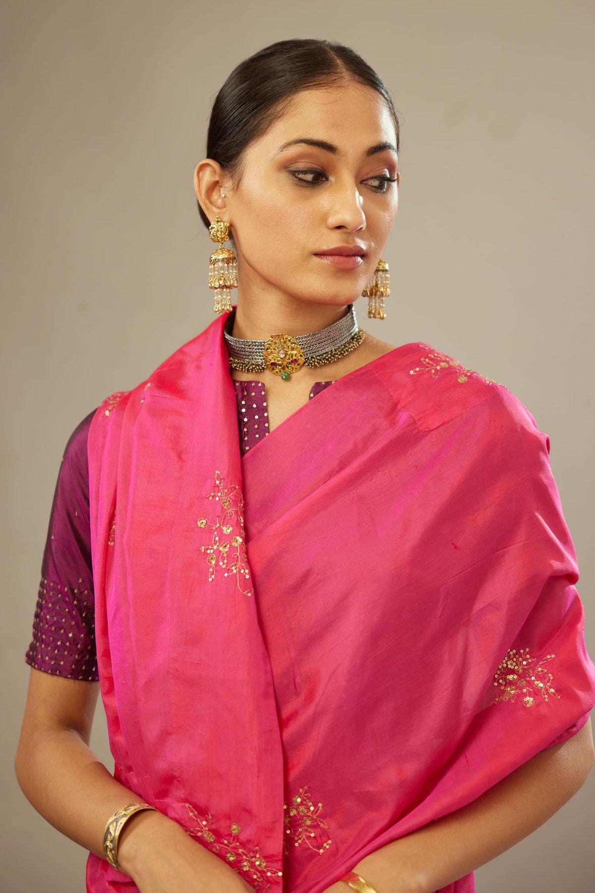 Raspberry silk saree set with hand embroidered delicate sequins floral butas all over.