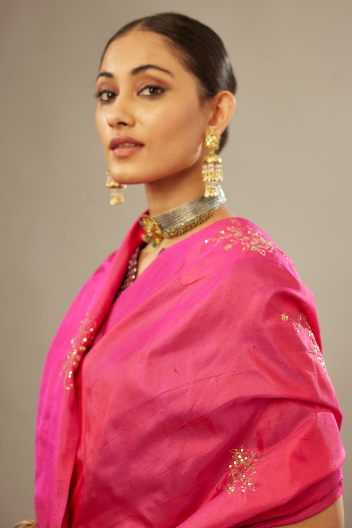 Raspberry silk saree set with hand embroidered delicate sequins floral butas all over.