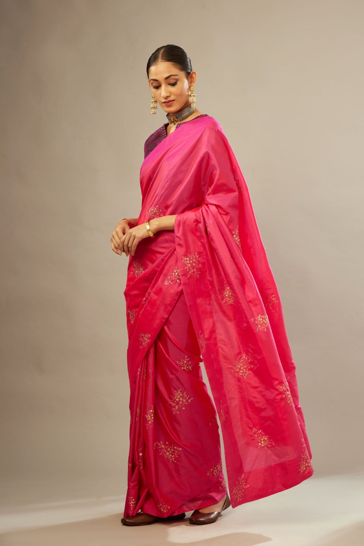Raspberry silk saree set with hand embroidered delicate sequins floral butas all over.