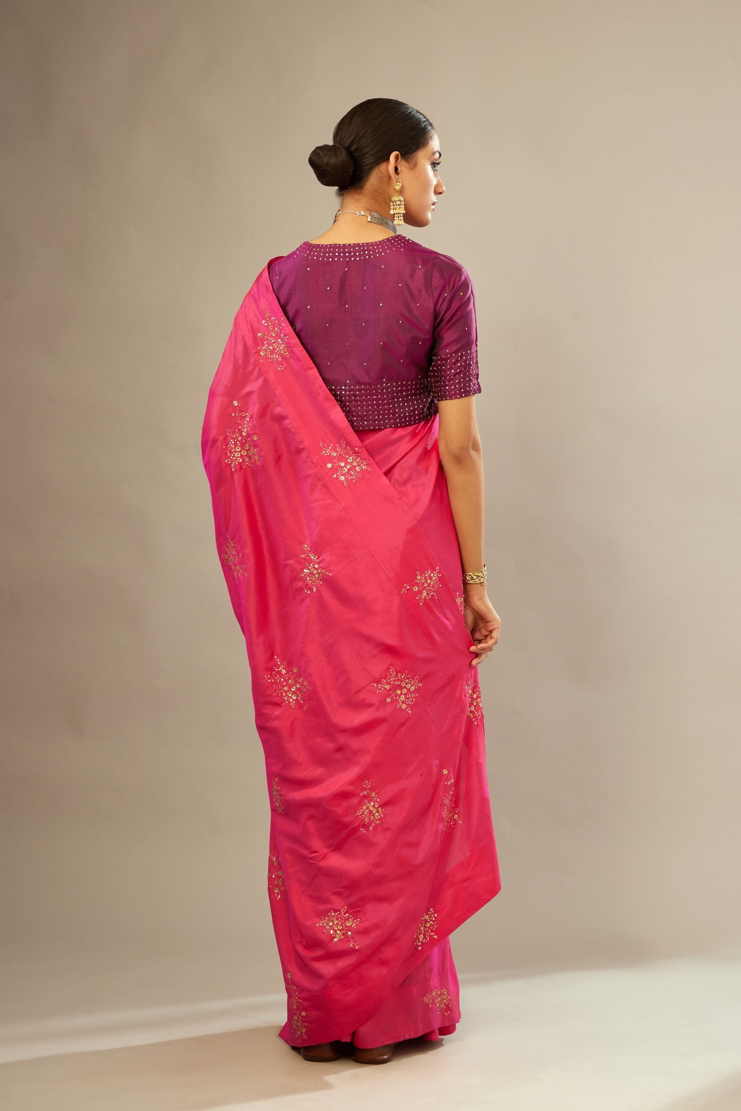 Sangria silk easy fit blouse with a slit neckline and bottom hem have a hand-embroidered geometric sequins band.