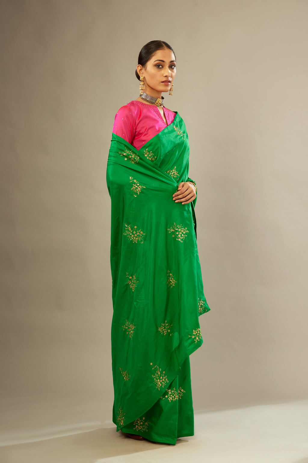 Grass green silk saree set with hand embroidered delicate sequins floral butas all over.