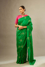 Grass green silk saree set with hand embroidered delicate sequins floral butas all over.