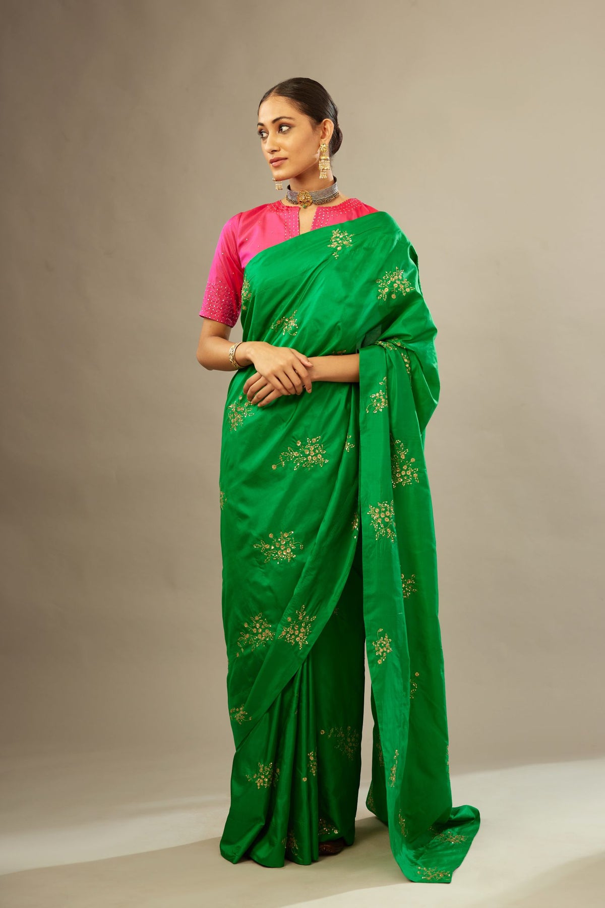 Grass green silk saree set with hand embroidered delicate sequins floral butas all over.