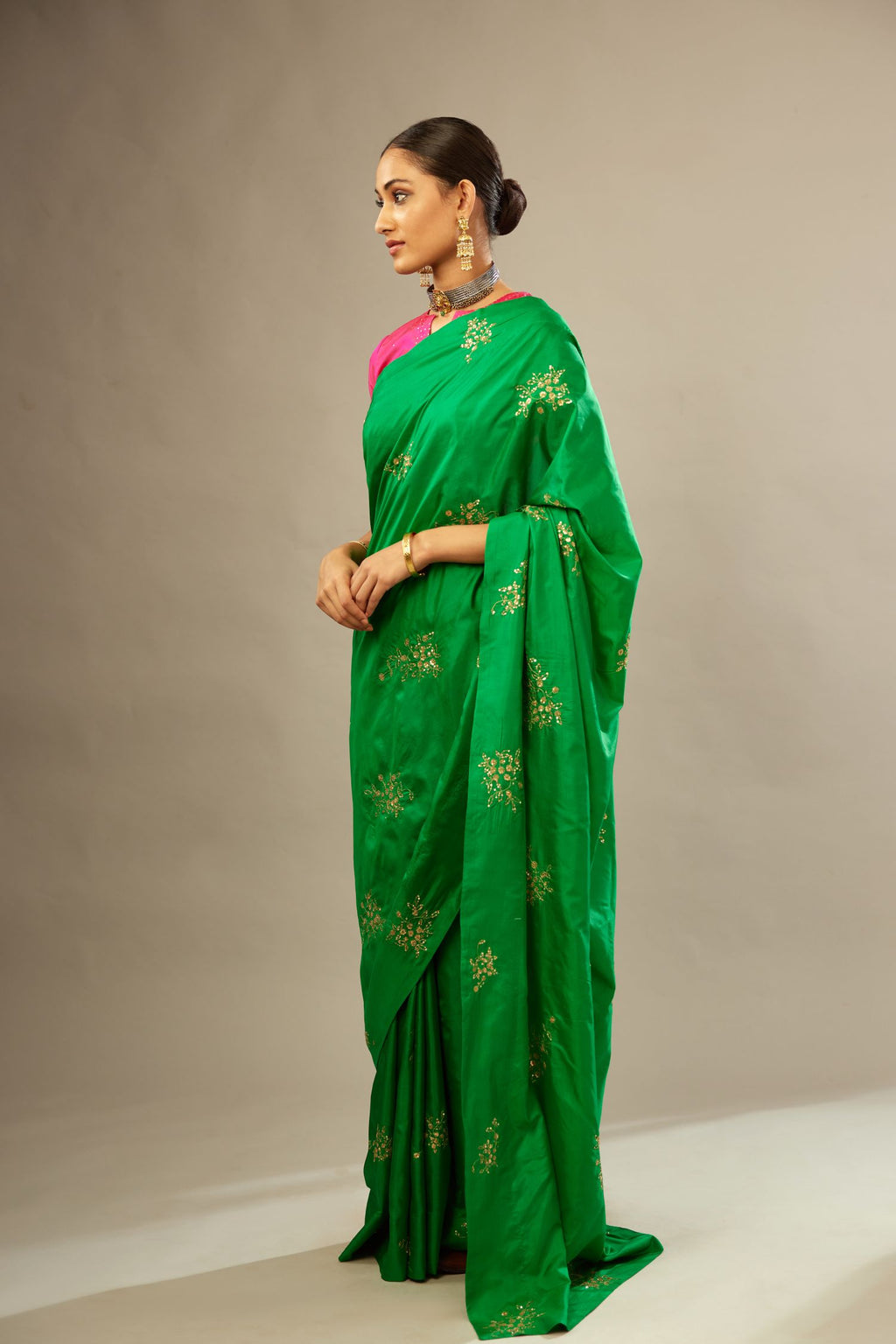 Grass green silk saree set with hand embroidered delicate sequins floral butas all over.