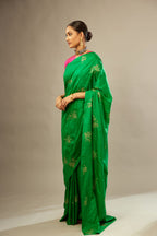 Grass green silk saree set with hand embroidered delicate sequins floral butas all over.