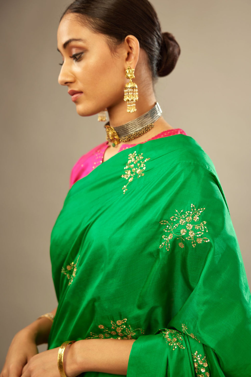 Grass green silk saree set with hand embroidered delicate sequins floral butas all over.