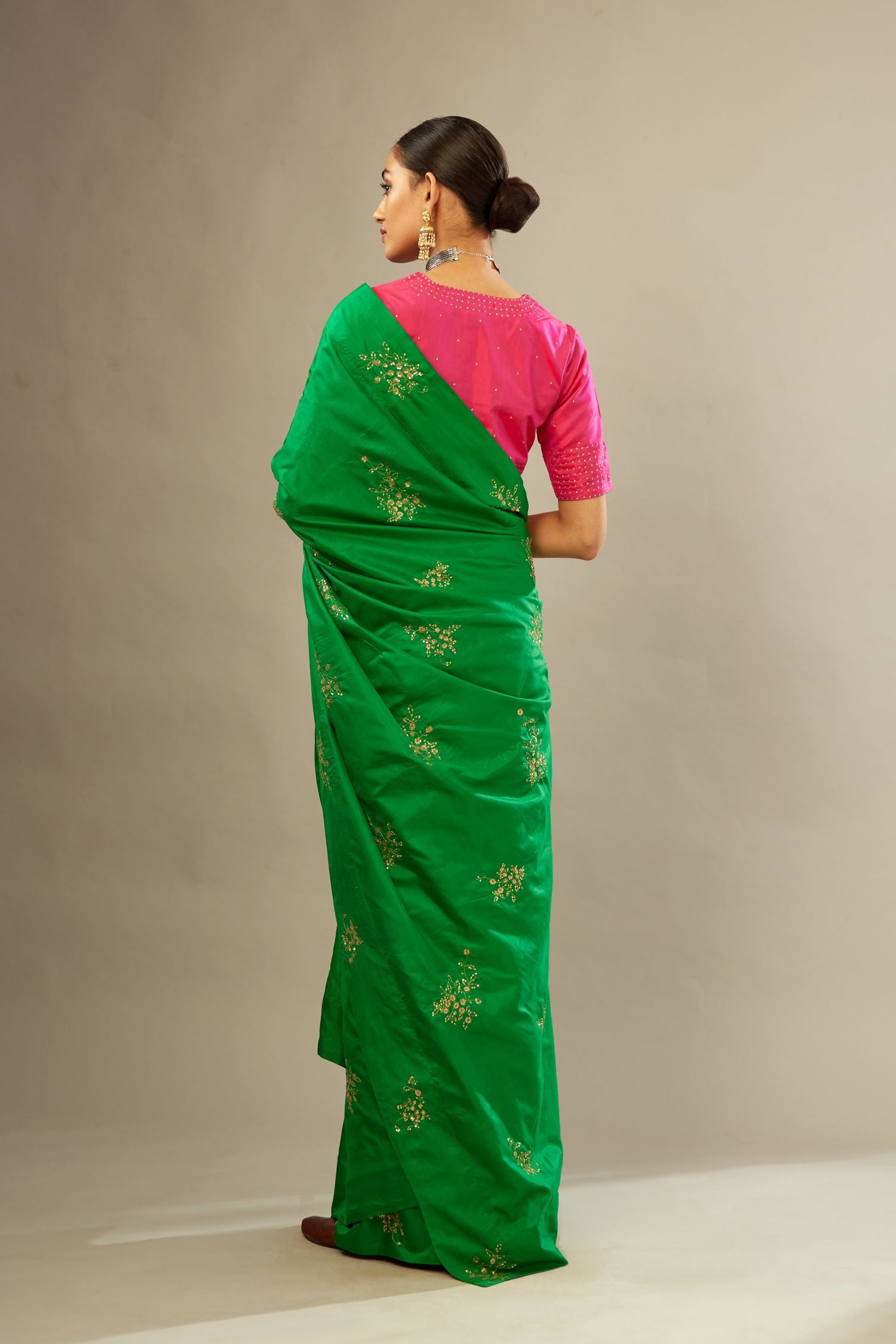 Raspberry silk easy fit blouse with a slit neckline and bottom hem have a hand-embroidered geometric sequins band.
