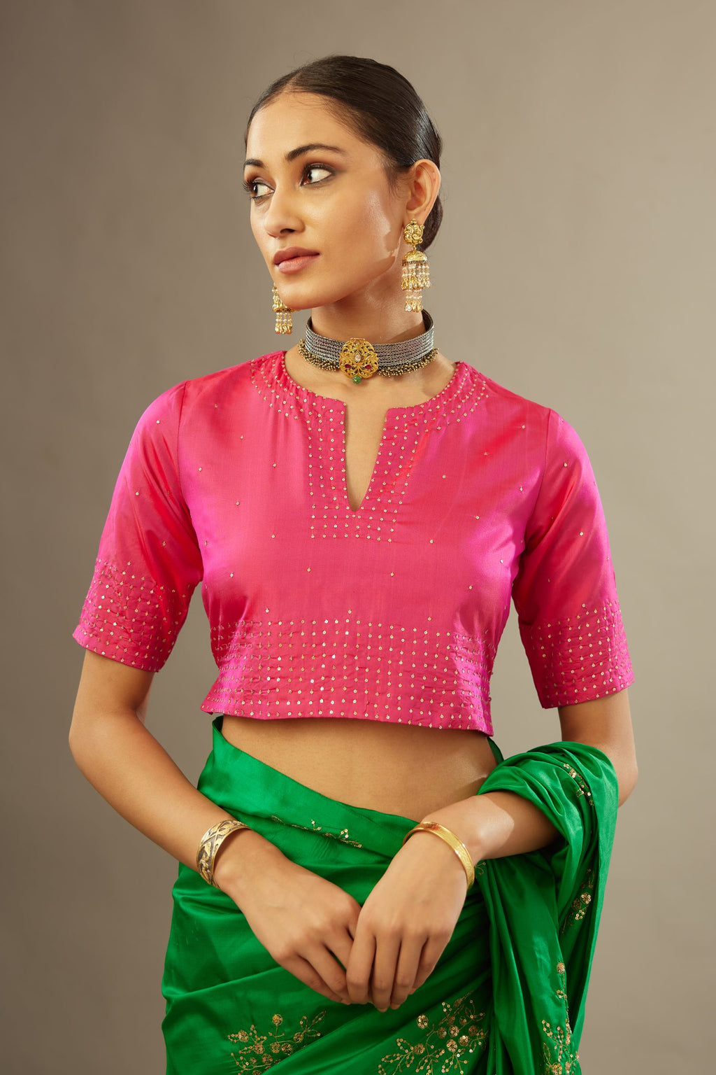 Raspberry silk easy fit blouse with a slit neckline and bottom hem have a hand-embroidered geometric sequins band.