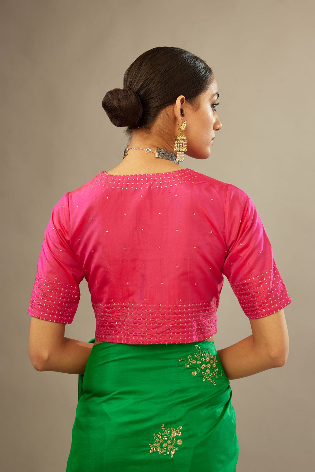 Raspberry silk easy fit blouse with a slit neckline and bottom hem have a hand-embroidered geometric sequins band.