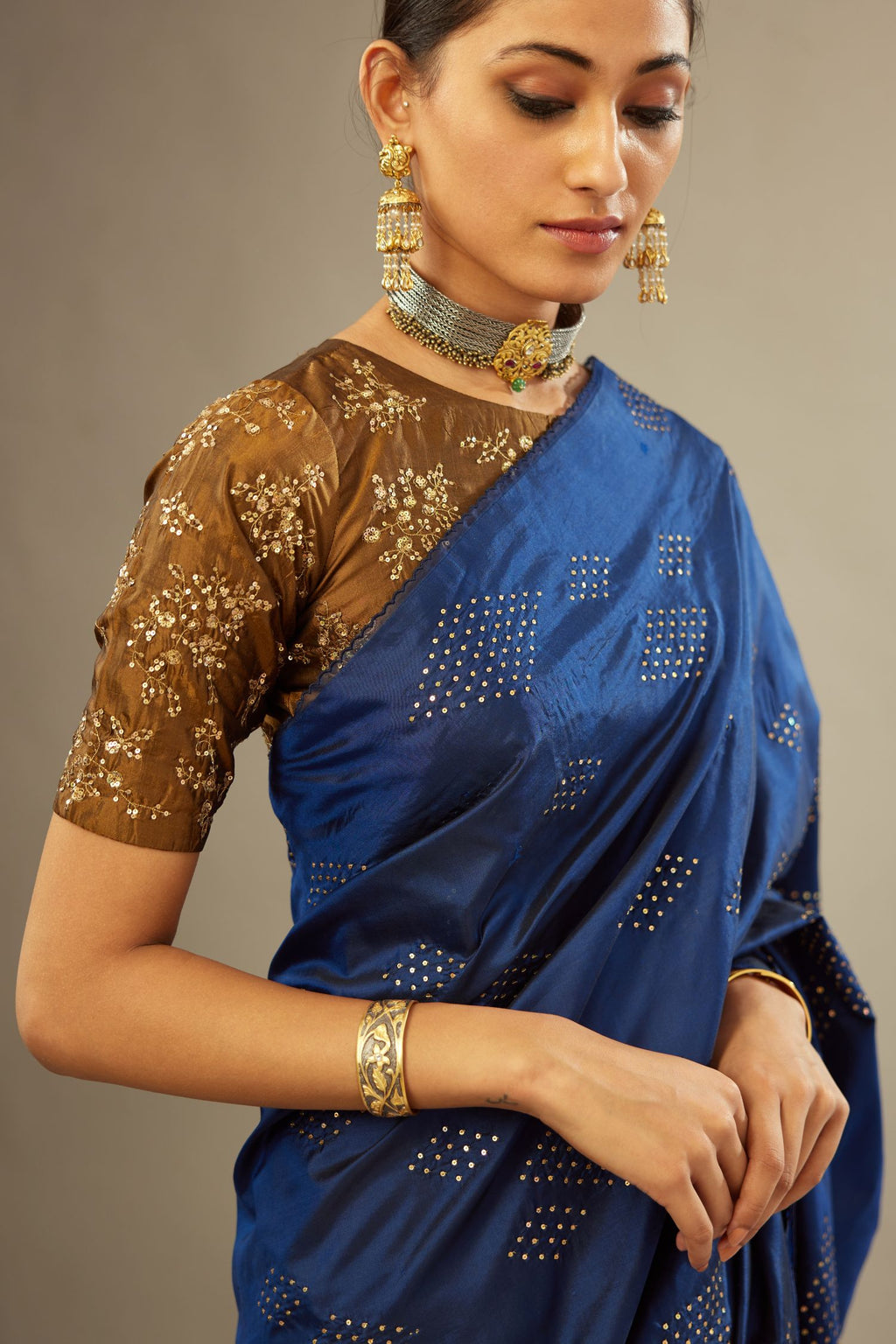 Navy blue silk saree set with all over hand embroidered geometric diamond motifs in sequins