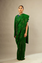 Dark green silk saree set with all over hand embroidered geometric diamond motifs in sequins.