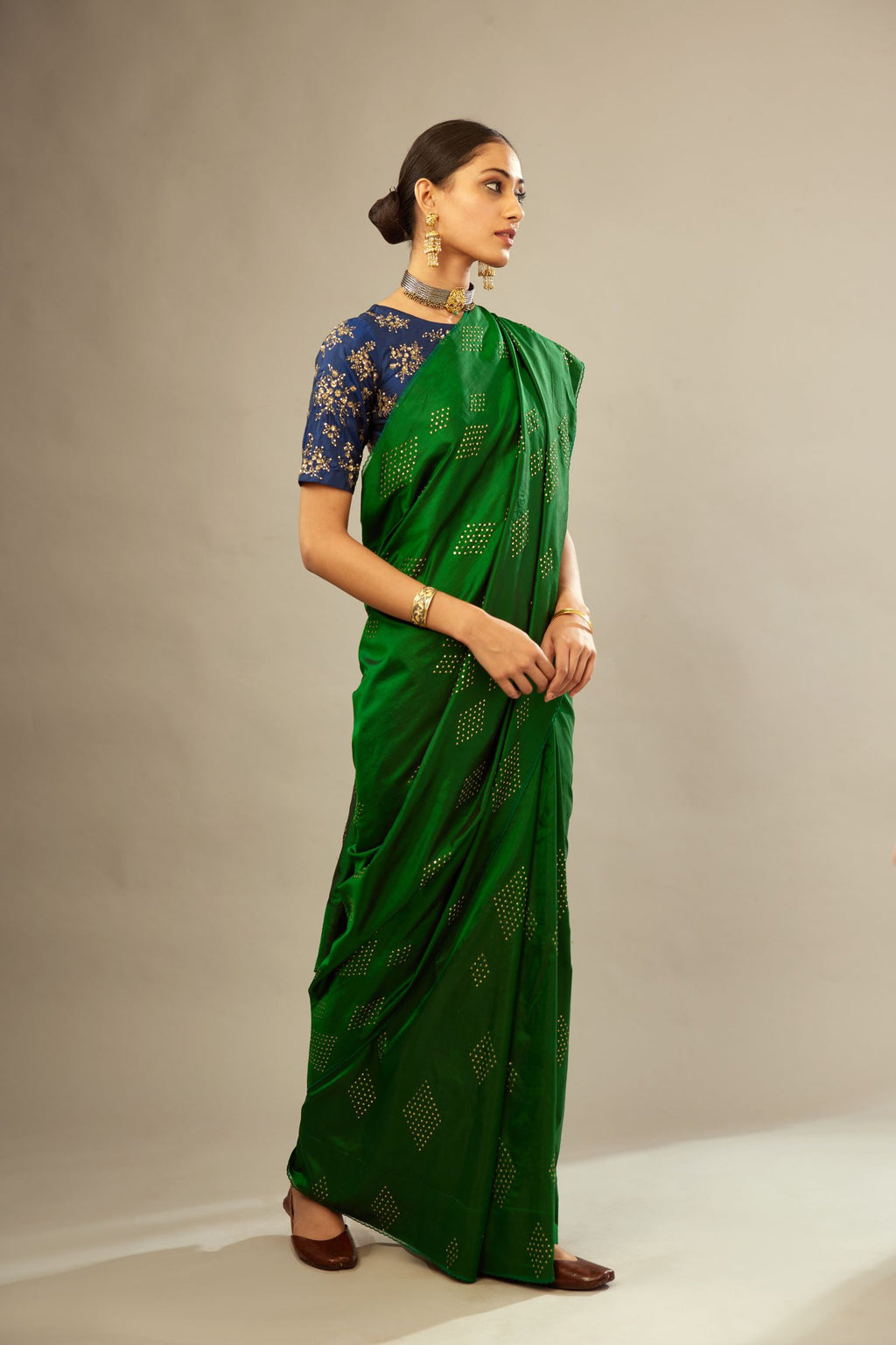 Dark green silk saree set with all over hand embroidered geometric diamond motifs in sequins.