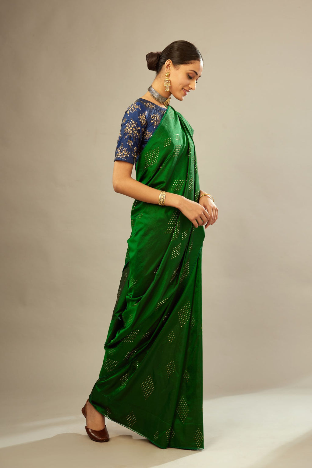 Dark green silk saree set with all over hand embroidered geometric diamond motifs in sequins.