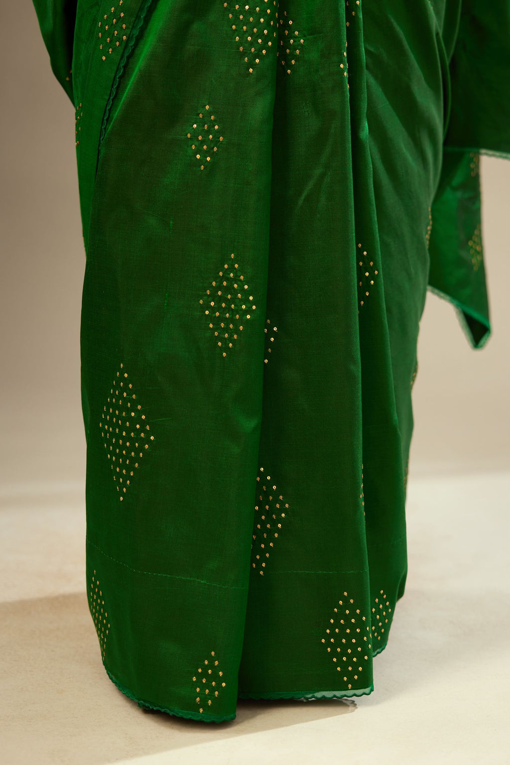 Dark green silk saree set with all over hand embroidered geometric diamond motifs in sequins.