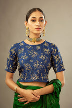Navy blue jewel neck easy fit blouse with a side zip opening and fully covered with hand embroidered delicate sequins butas in light gold.