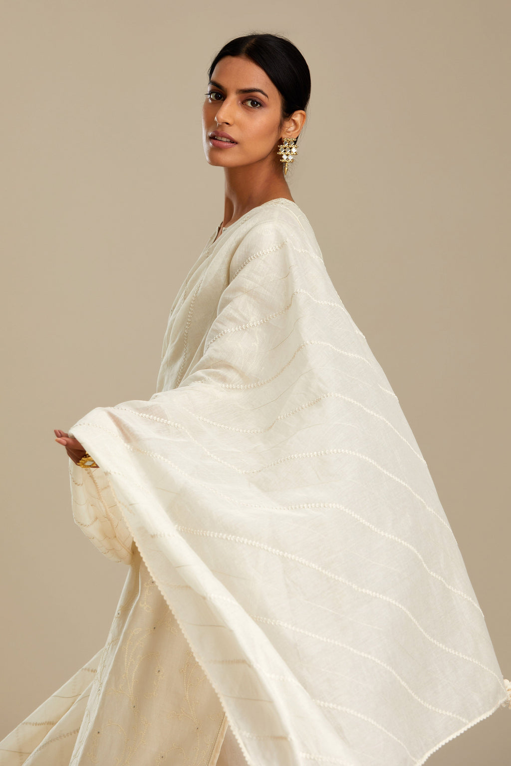 Off white silk chanderi straight kurta set with all-over tonal silk thread embroidery.