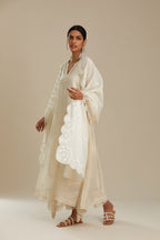 Off white cotton Chanderi kurta set with asymmetric hem, highlighted with sequins, beads and lace.
