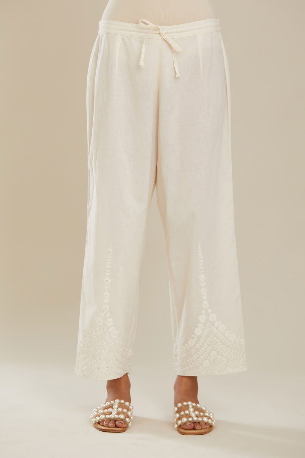 Off white cotton straight pants with dori embroidery at hem. (Pants)