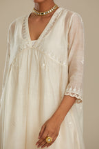 Off white cotton chanderi kurta set with tonal silk thread embroidery highlighted with sequins and beads.