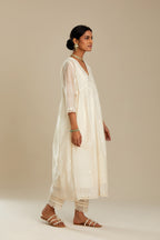 Off white cotton chanderi kurta set with tonal silk thread embroidery highlighted with sequins and beads.