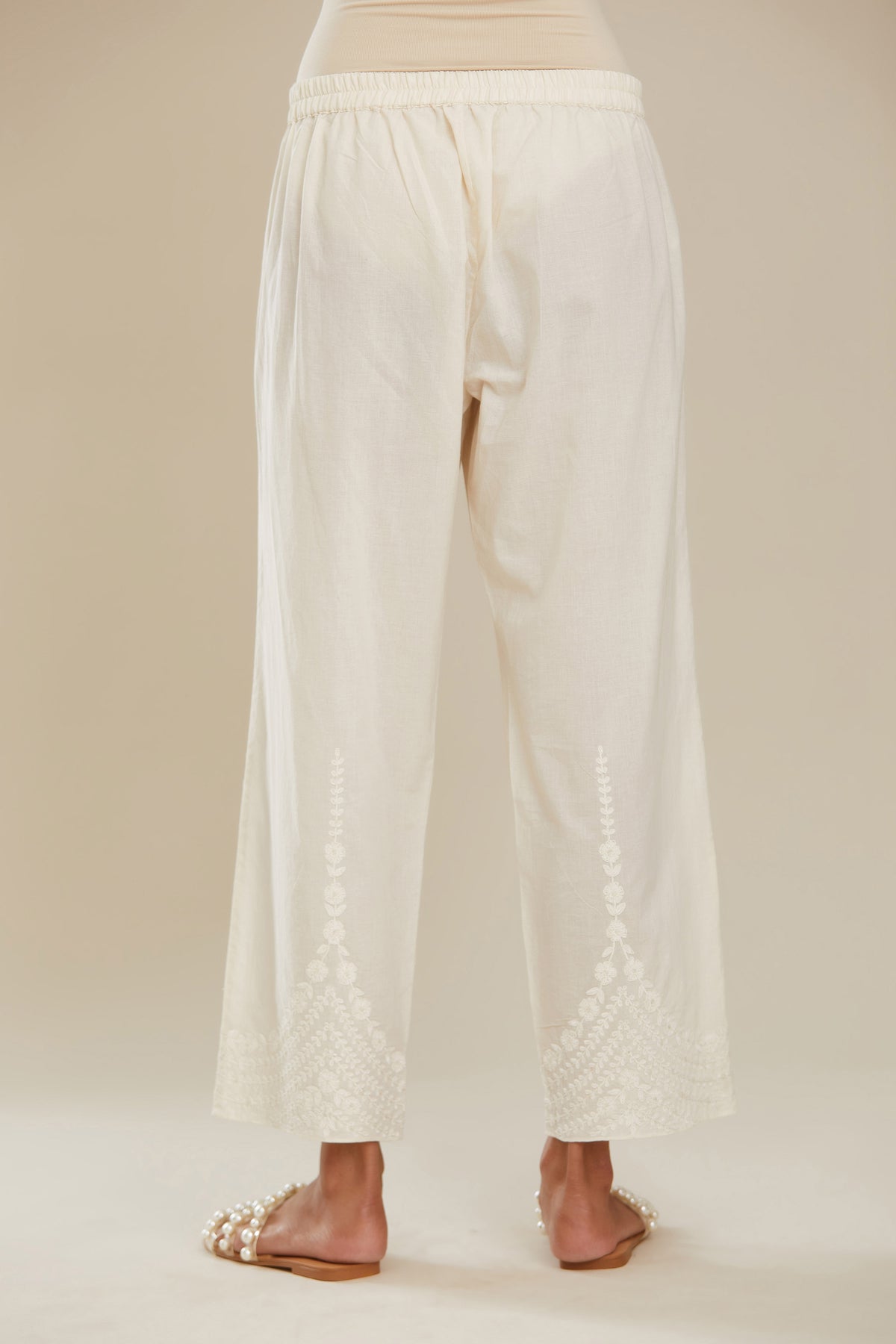 Off white cotton straight pants with dori embroidery at hem. (Pants)