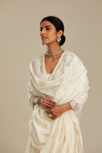 Off white cotton chanderi kurta set with tonal silk thread embroidery highlighted with sequins and beads.