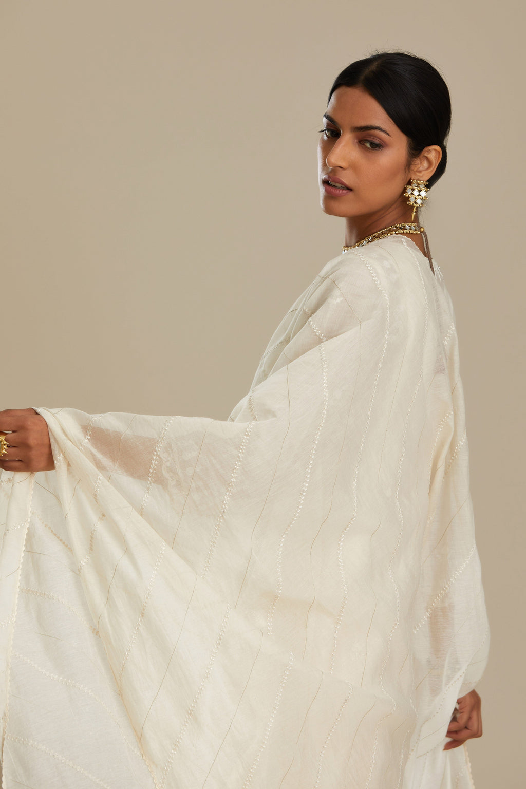 Cotton chanderi Kurta dress set with front gathers and all-over tonal thread embroidery, highlighted with sequins and beads.