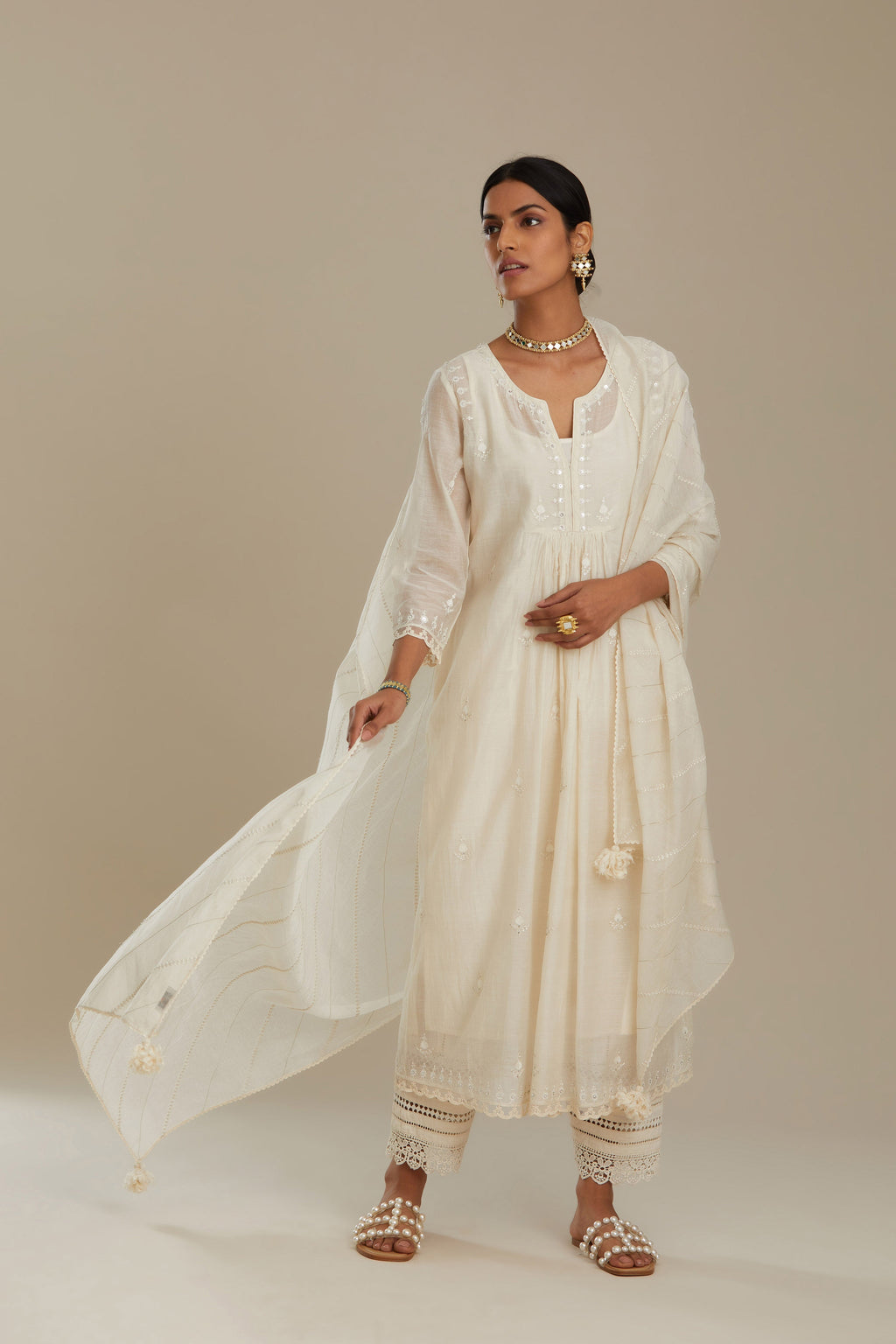 Cotton chanderi Kurta dress set with front gathers and all-over tonal thread embroidery, highlighted with sequins and beads.