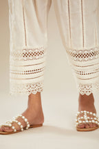 Off white cotton narrow salwar with assorted lace detailing. (Salwar)