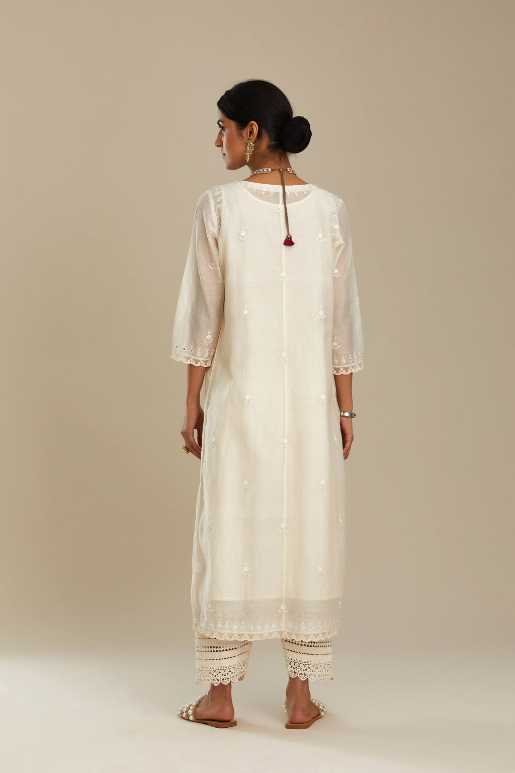 Cotton chanderi Kurta dress set with front gathers and all-over tonal thread embroidery, highlighted with sequins and beads.