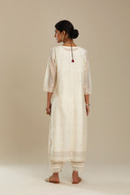 Cotton chanderi Kurta dress set with front gathers and all-over tonal thread embroidery, highlighted with sequins and beads.