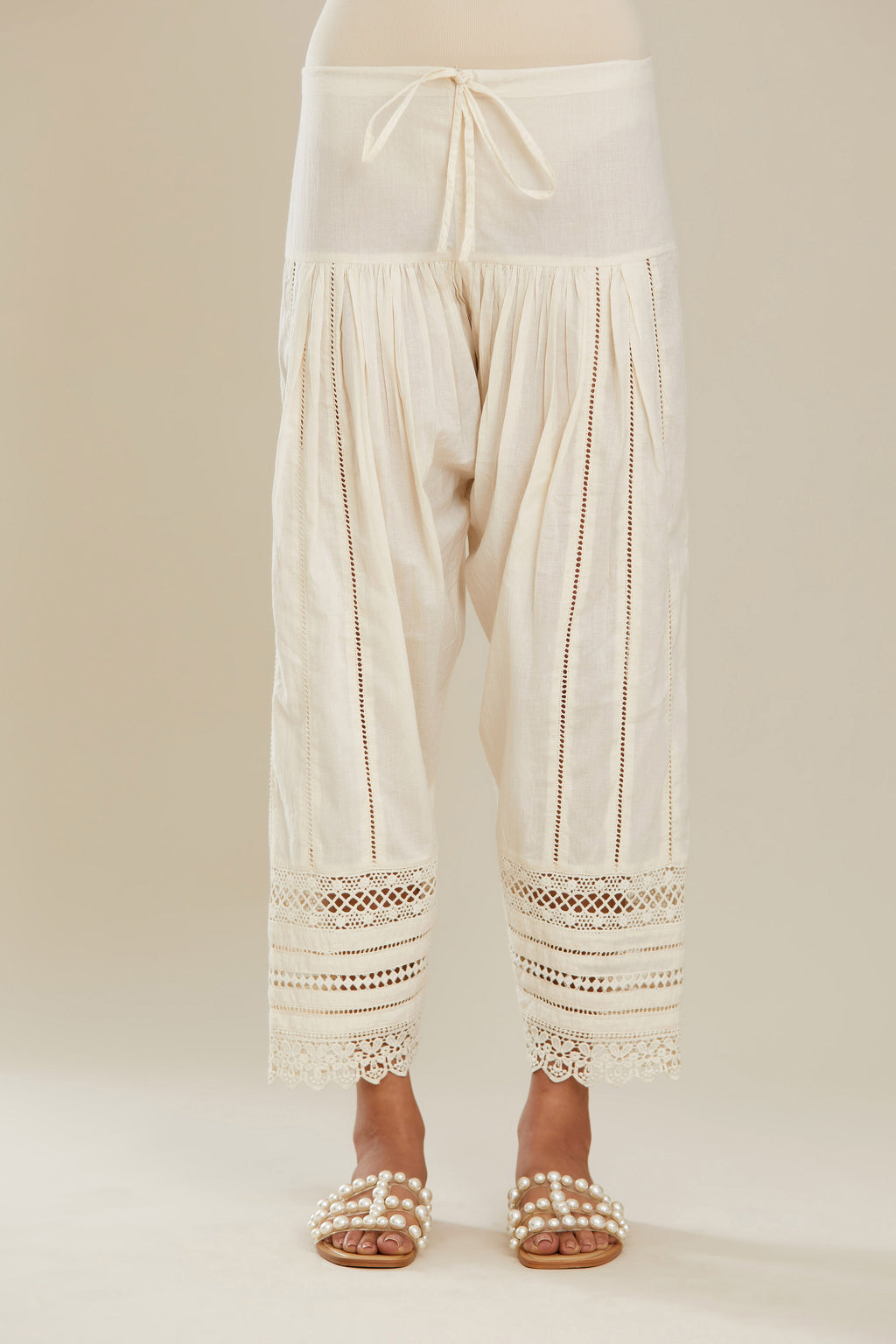 Off white cotton narrow salwar with assorted lace detailing. (Salwar)