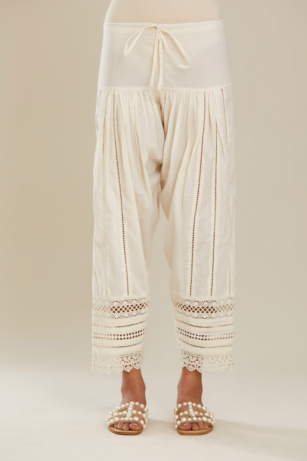 Off white cotton narrow salwar with assorted lace detailing. (Salwar)