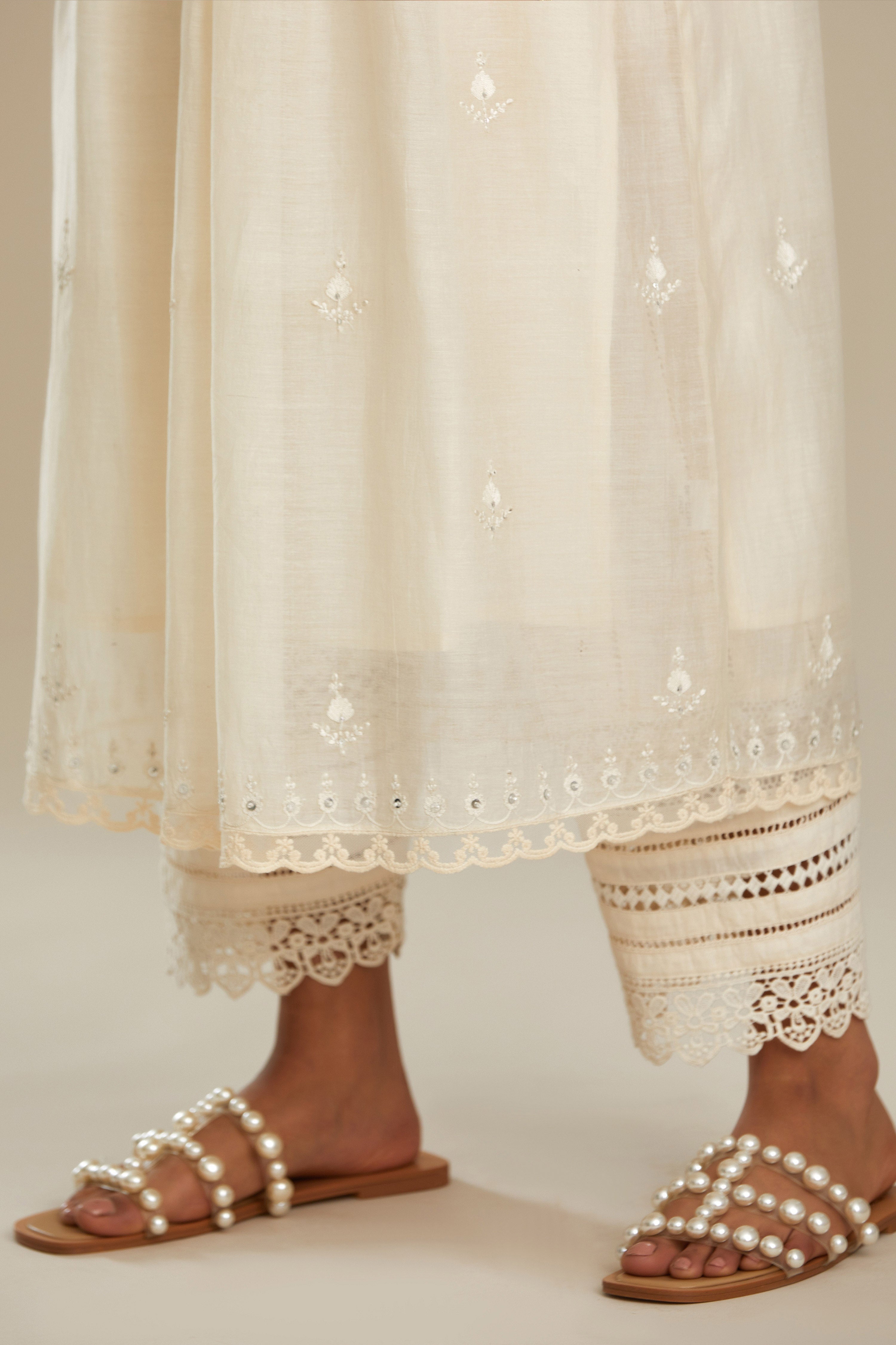 Cotton chanderi Kurta dress set with front gathers and all-over tonal thread embroidery, highlighted with sequins and beads.